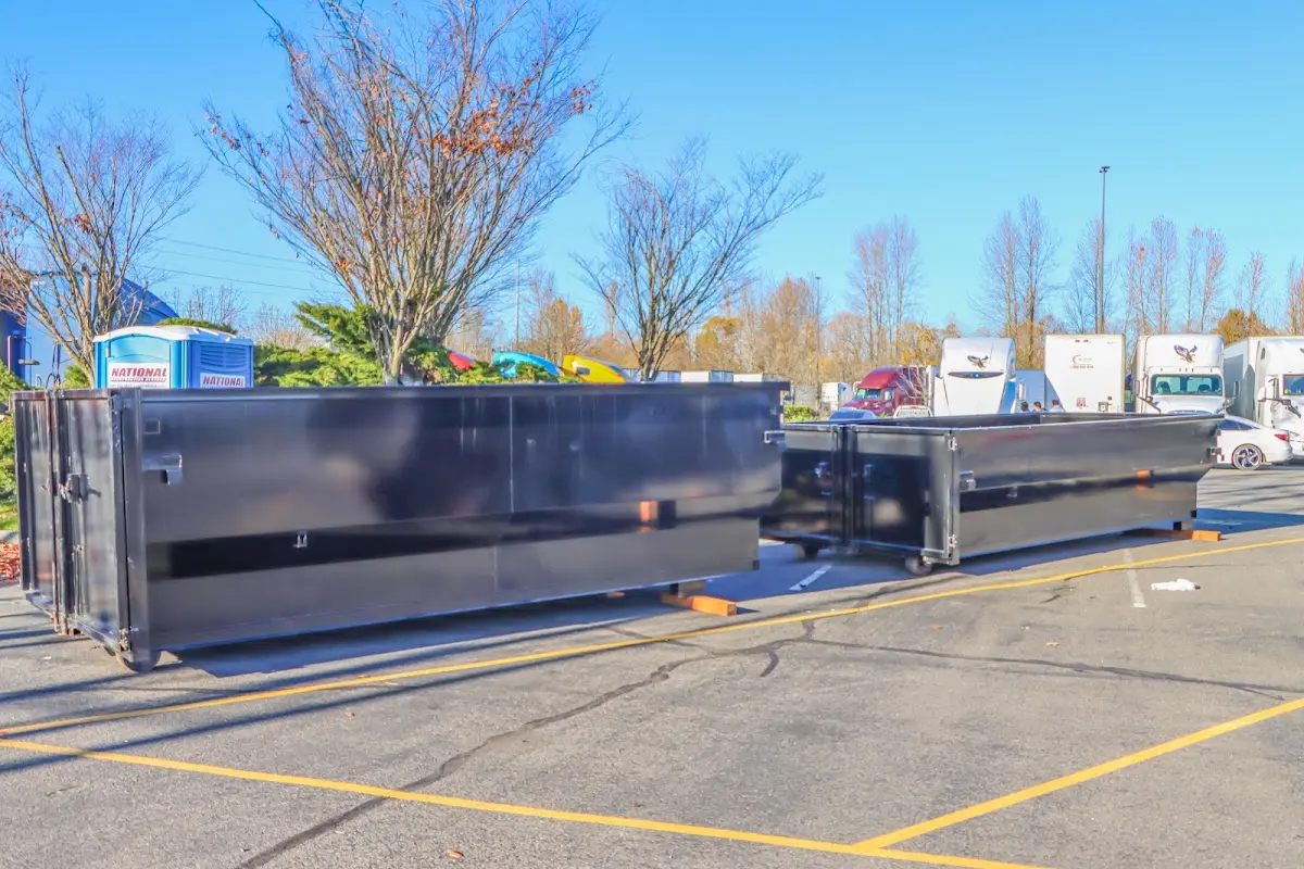 Professional dumpster rental service with roll-off container on residential driveway in North St. Paul